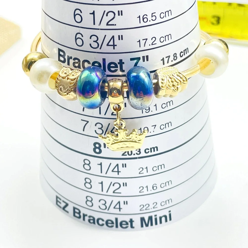 D'Bello Gold Tone Cuff Bracelet Blue Crystal Beads Crown Charm Adjustable NWT